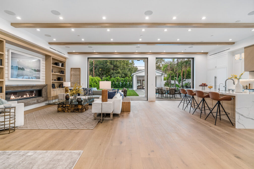 Large open concept living and dining space with an area rug